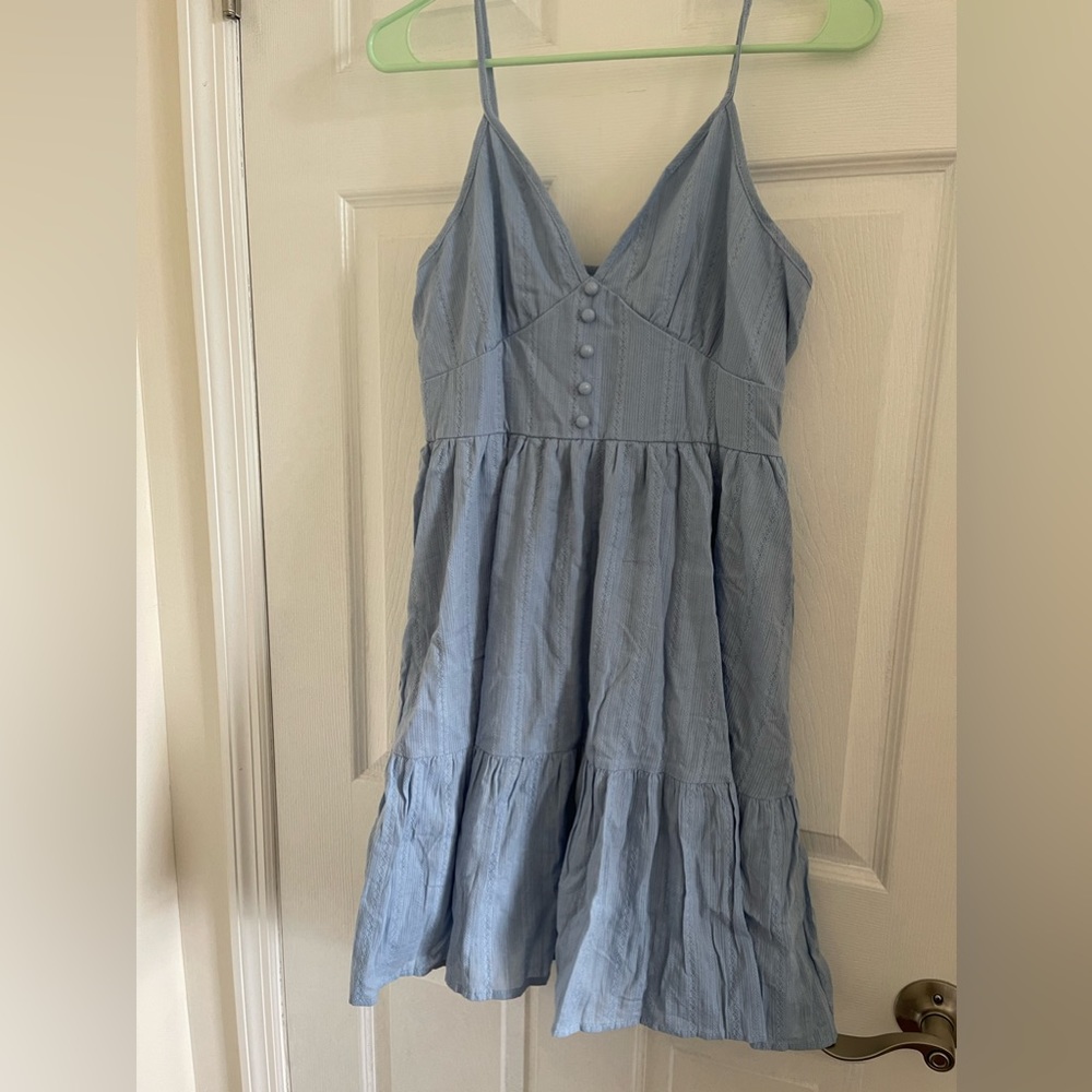 Blue tiered sundress with spaghetti straps and eyelet embroidery